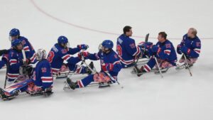 Team USA reacts after winning the Group A hockey match