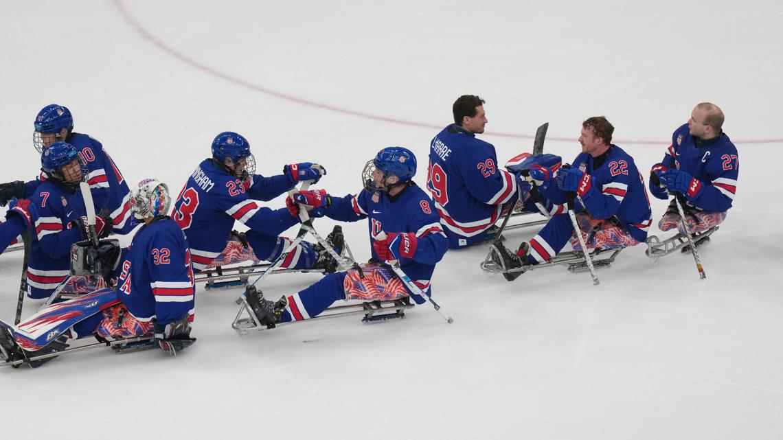 Team USA reacts after winning the Group A hockey match