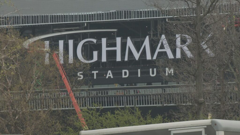 Exterior construction site of the new Buffalo Bills stadium showing the installation of new signage