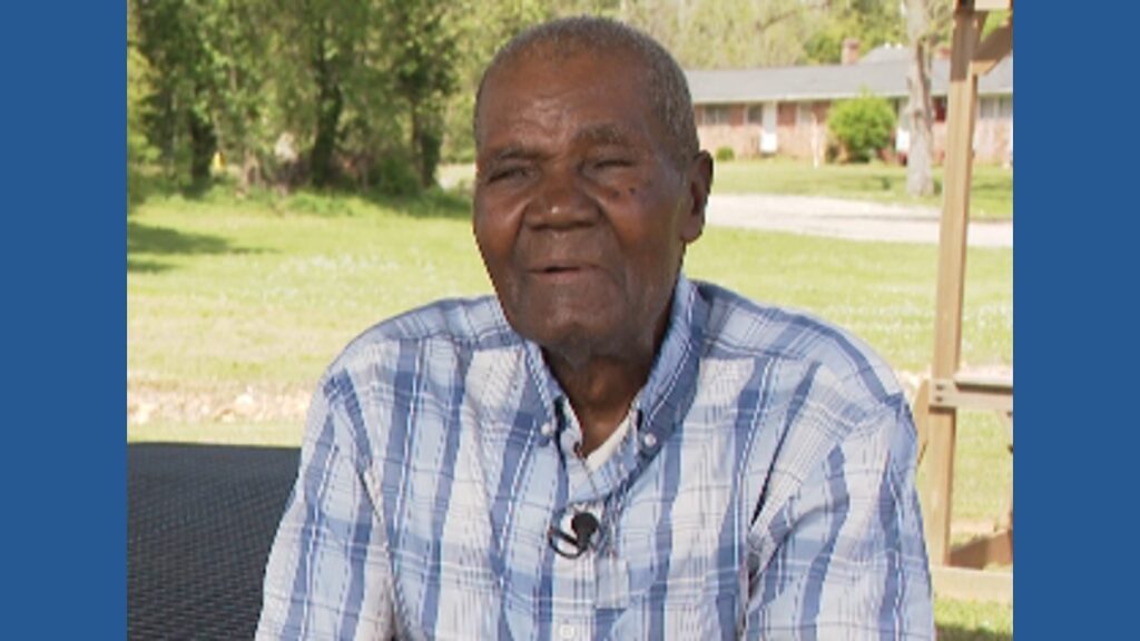 90-year-old custodian Clemmie Adams being recognized for his lifelong hard work and dedication to his community