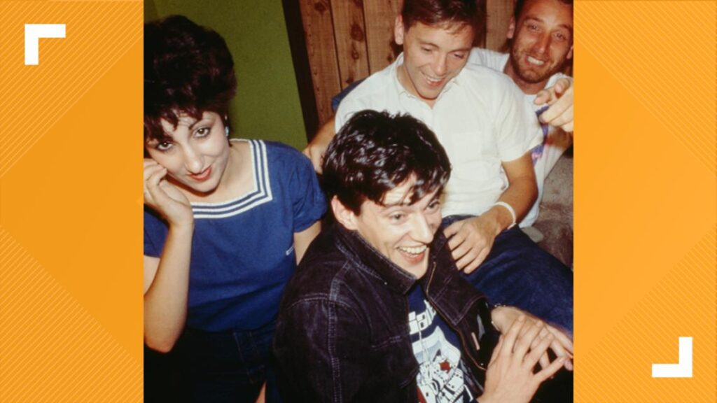 Sade Adu singing soulfully into a studio microphone