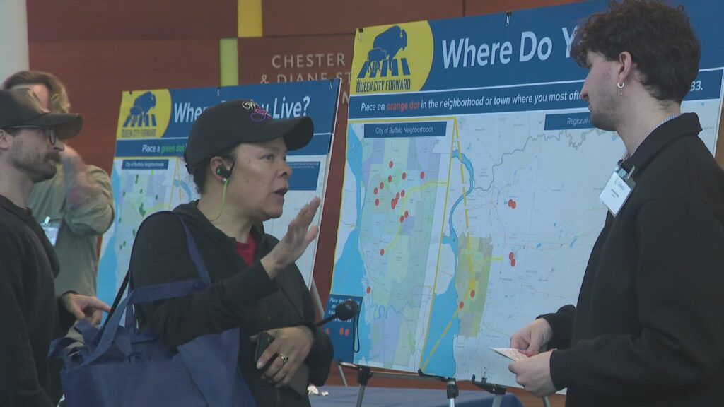 Heavy road construction machinery laying down new asphalt on a county highway