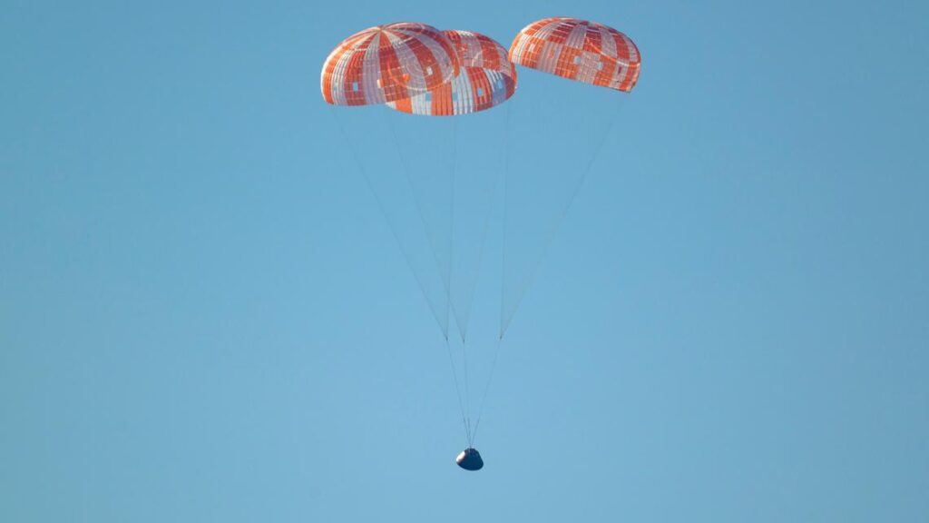 The Artemis II capsule splashing down in the Pacific Ocean after a historic lunar mission