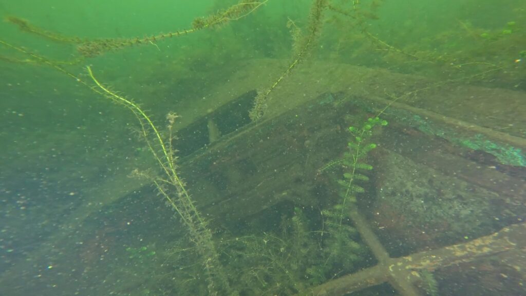 An underwater remotely operated vehicle documenting a shipwreck