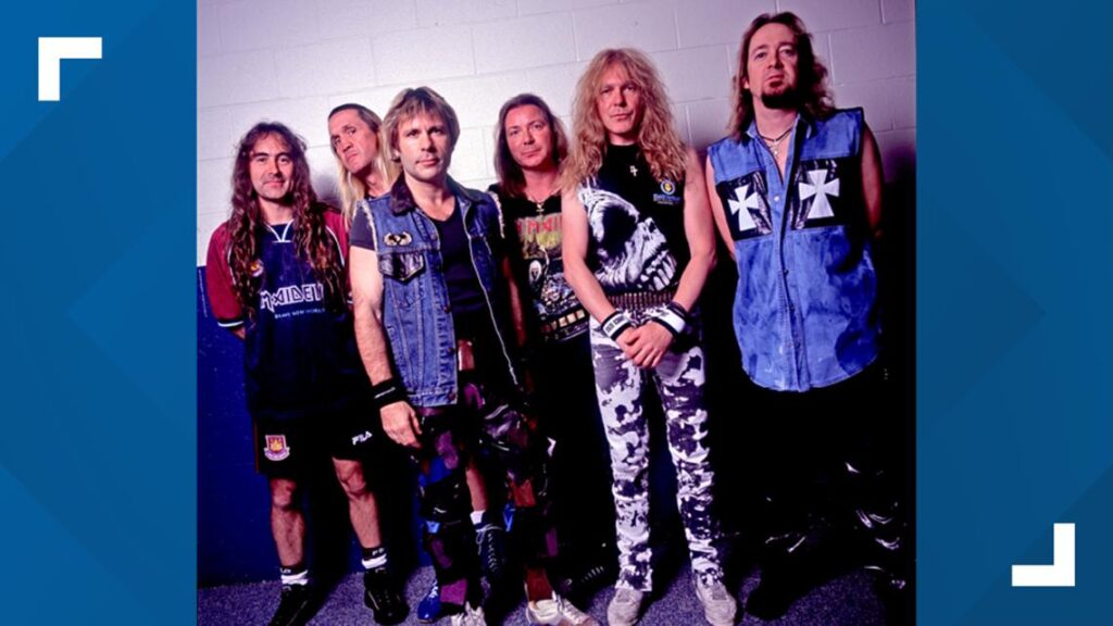 Iron Maiden rock band members performing a high-energy heavy metal concert